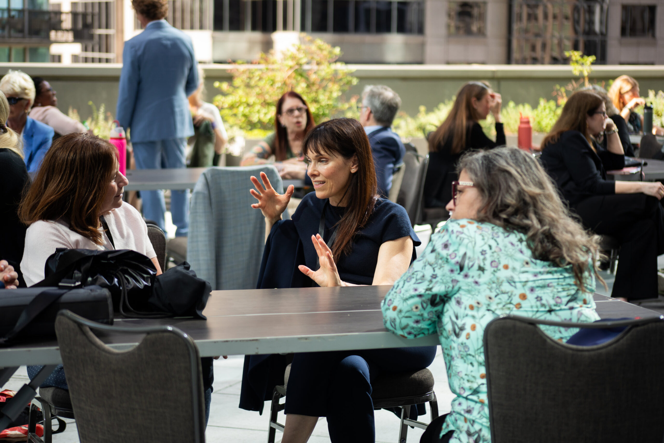 NCFP Forum attendees discussing things around a table.